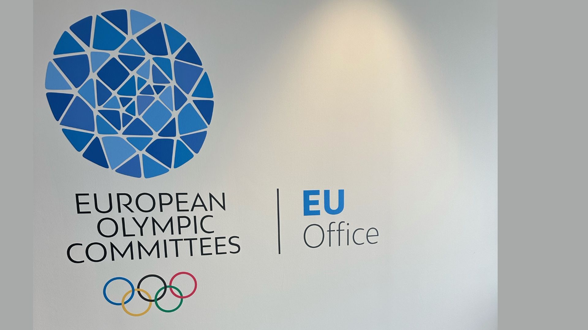 A photo of a banner which shows the EOC logo, plus the words 'European Olympic Committees' and 'EU Office'