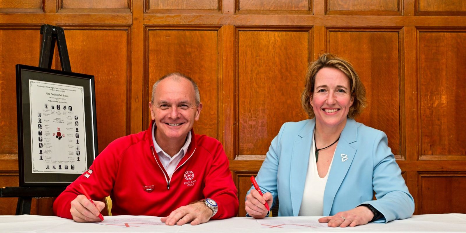 England Golf CEO Jeremy Tomlinson and IWG Secretary General Lisa O'Keefe sign the Brighton Plus Helsinki Declaration